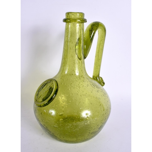 33 - AN UNUSUAL ENGLISH GREEN GLASS WINE BOTTLE. 23 cm high.