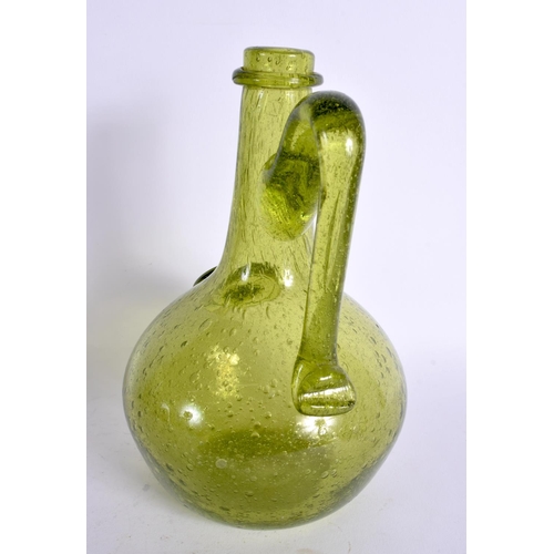 33 - AN UNUSUAL ENGLISH GREEN GLASS WINE BOTTLE. 23 cm high.