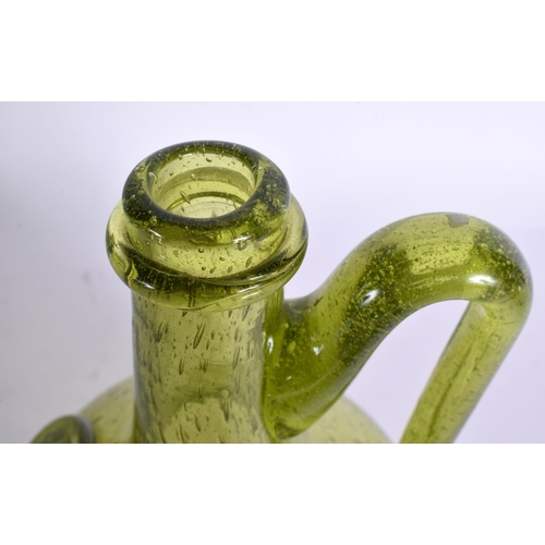 33 - AN UNUSUAL ENGLISH GREEN GLASS WINE BOTTLE. 23 cm high.