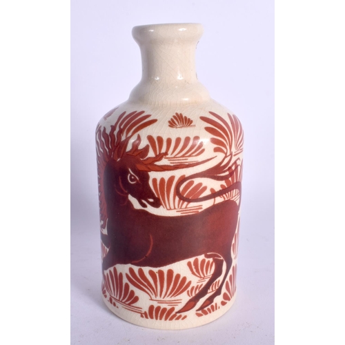 38 - A WILLIAM DE MORGAN STYLE IRON RED POTTERY VASE. 15 cm high.