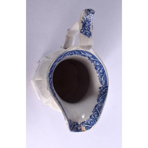 60 - AN UNUSUAL ANTIQUE BLUE AND WHITE JUG printed with figures. 17 cm high.