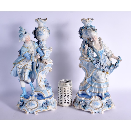 63 - A GOOD LARGE PAIR OF 19TH CENTURY GERMAN BLUE AND WHITE PORCELAIN FIGURES modelled as a female and f... 