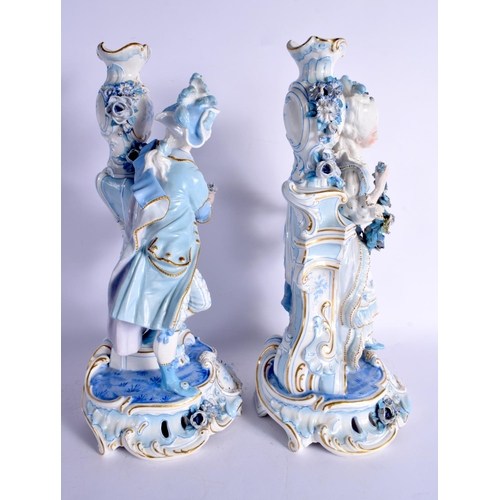 63 - A GOOD LARGE PAIR OF 19TH CENTURY GERMAN BLUE AND WHITE PORCELAIN FIGURES modelled as a female and f... 