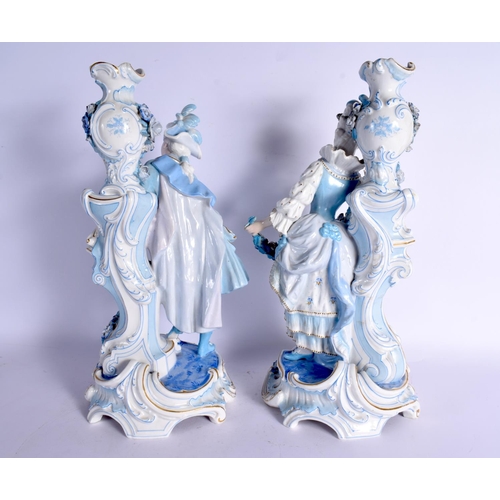 63 - A GOOD LARGE PAIR OF 19TH CENTURY GERMAN BLUE AND WHITE PORCELAIN FIGURES modelled as a female and f... 