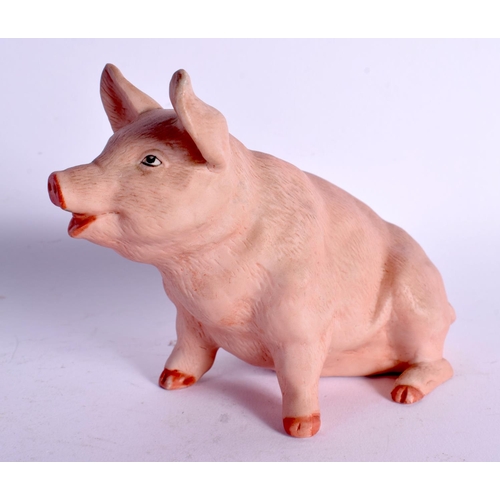 65 - A CONTINENTAL BISQUE PORCELAIN FIGURE OF A PIG. 11 cm x 11 cm.