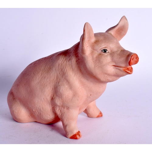 65 - A CONTINENTAL BISQUE PORCELAIN FIGURE OF A PIG. 11 cm x 11 cm.