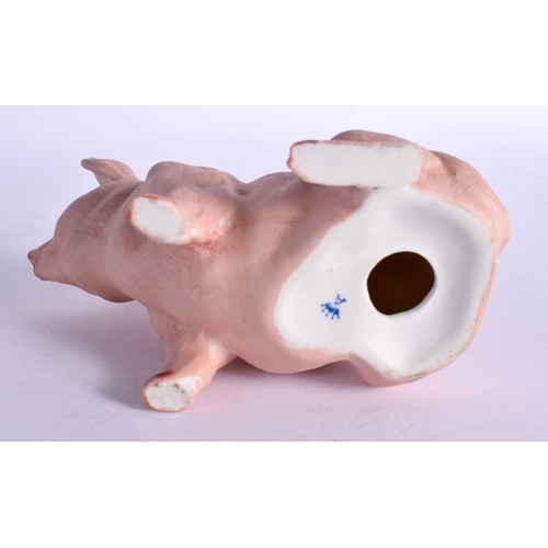 65 - A CONTINENTAL BISQUE PORCELAIN FIGURE OF A PIG. 11 cm x 11 cm.