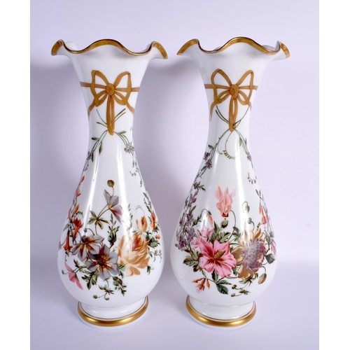 71 - A PAIR OF FRENCH 19TH CENTURY OPALINE PAINTED VASES decorated with ribbon and native elaborate flora... 