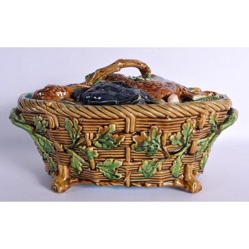 73 - A 19TH CENURY MINTON MAJOLICA GAME PIE DISH with overlapping dead game on a bed of leaves, the lower... 