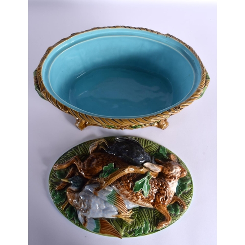 73 - A 19TH CENURY MINTON MAJOLICA GAME PIE DISH with overlapping dead game on a bed of leaves, the lower... 