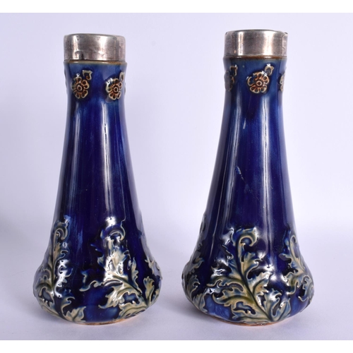 87 - A PAIR OF ANTIQUE SILVER MOUNTED ROYAL DOULTON VASES. 16.5 cm high.