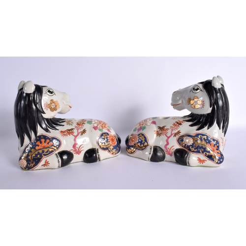 98 - A PAIR OF CONTINENTAL PORCELAIN HORSES. 21 cm x 18 cm.