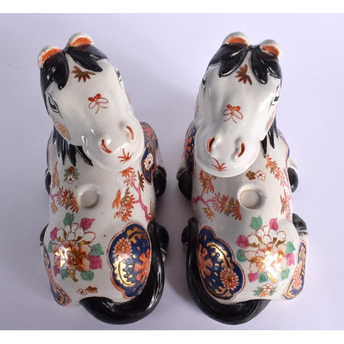 98 - A PAIR OF CONTINENTAL PORCELAIN HORSES. 21 cm x 18 cm.