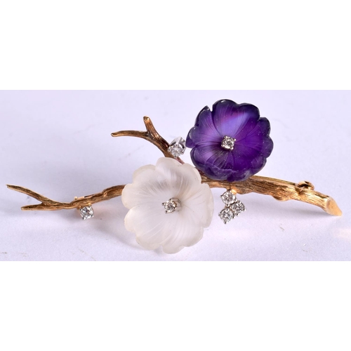 1094 - AN 18CT GOLD BROOCH WITH AMETHYST AND ROCK CRYSTAL BLOSSOM INSET WITH DIAMONDS.  Stamped 18K, 6.2cm ... 