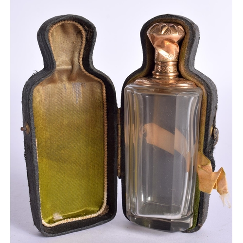 1100 - A GOLD TOPPED SCENT BOTTLE IN A FITTED CASE WITH VELVET LINING.  Bottle 9cm x 3.3cm x 2.5cm