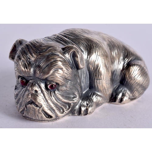 1102 - A CONTINENTAL SILVER MODEL OF A SEATED DOG WITH GEM SET EYES.  Stamped 84, 3.1cm x 6.6cm x 3.4cm, we... 