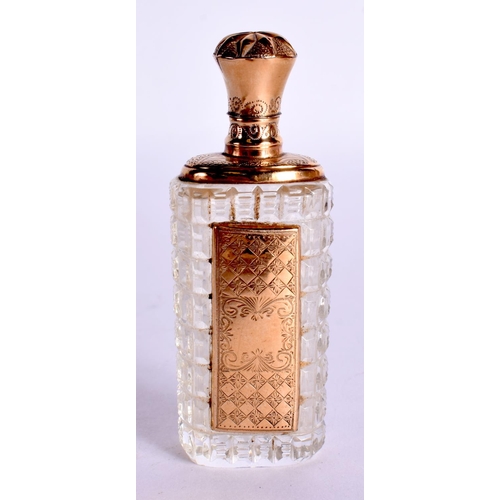 1104 - A GOLD TOPPED SCENT BOTTLE.  8.7cm x 3.2cm x 2.4cm, weight 48.3g