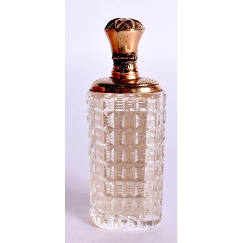 1104 - A GOLD TOPPED SCENT BOTTLE.  8.7cm x 3.2cm x 2.4cm, weight 48.3g