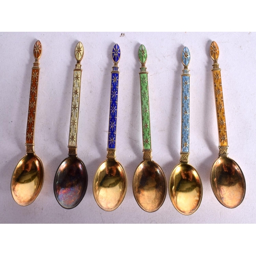 1110 - A SET OF SIX CONTINENTAL SILVER GILT AND ENAMEL COFFEE SPOONS.  Stamped 925. 9.2cm x 1.7cm, total we... 