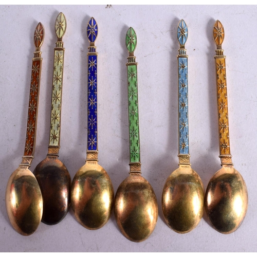 1110 - A SET OF SIX CONTINENTAL SILVER GILT AND ENAMEL COFFEE SPOONS.  Stamped 925. 9.2cm x 1.7cm, total we... 