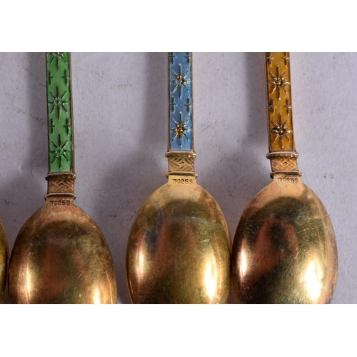 1110 - A SET OF SIX CONTINENTAL SILVER GILT AND ENAMEL COFFEE SPOONS.  Stamped 925. 9.2cm x 1.7cm, total we... 