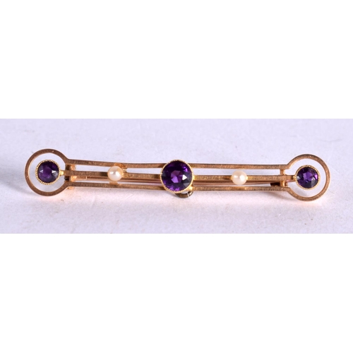 1245 - A 15CT GOLD BAR BROOCH INSET WITH PEARLS AND PURPLE GEMS.  5cm long, weight 3.7g