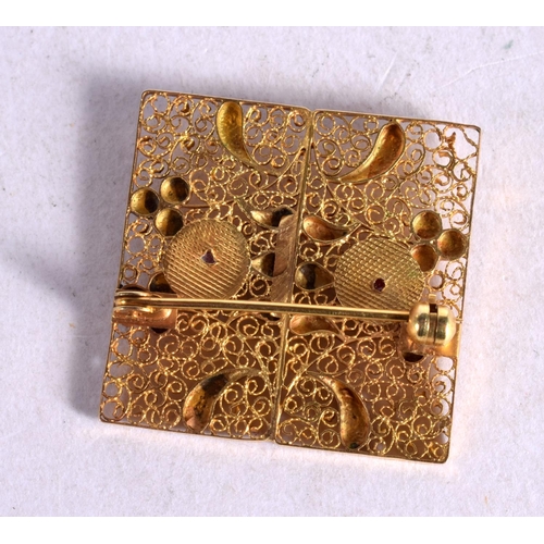 1261 - ANTIQUE FILIGREE GOLD AND CORAL BROOCH.  2.8cm x 2.8cm, weight 4.2g