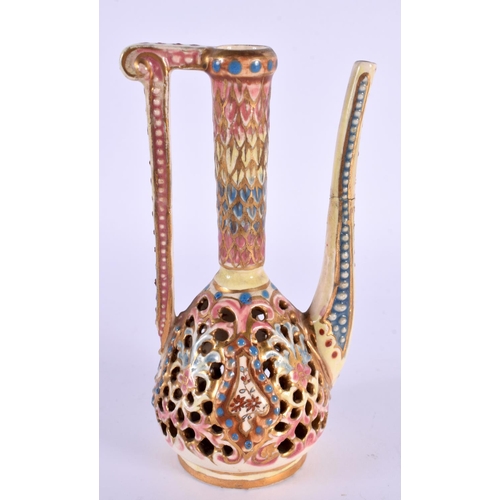 103 - A HUNGARIAN FAIENCE RETICULATED ZSOLNAY TYPE EWER. 14 cm high.