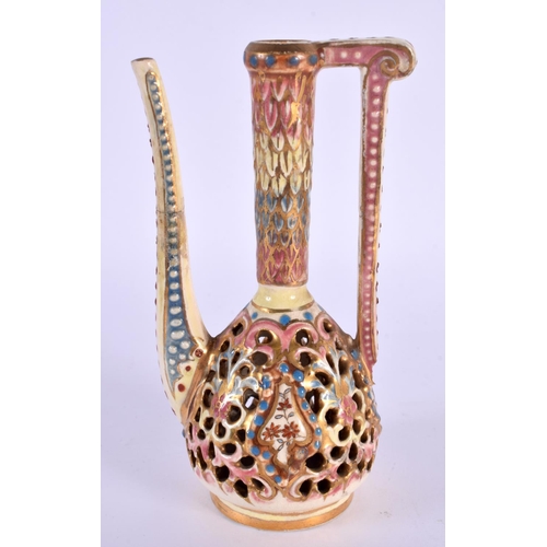 103 - A HUNGARIAN FAIENCE RETICULATED ZSOLNAY TYPE EWER. 14 cm high.