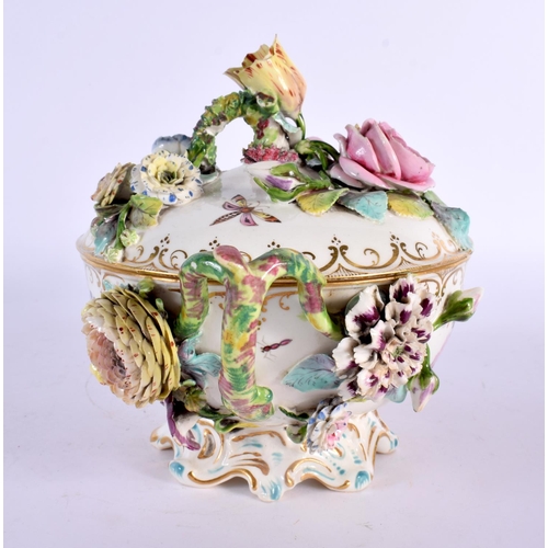 109 - 19th century ecuelle and cover painted and encrusted with flowers probably Chamberlains. 15cm High