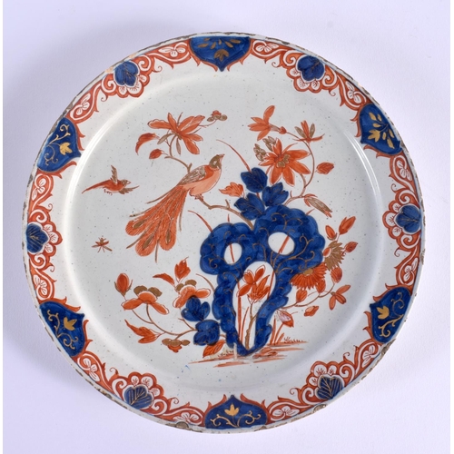 11 - A RARE 18TH CENTURY DELFT IMARI TIN GLAZED ENAMEL PLATE painted with a bird perched amongst flowerin... 