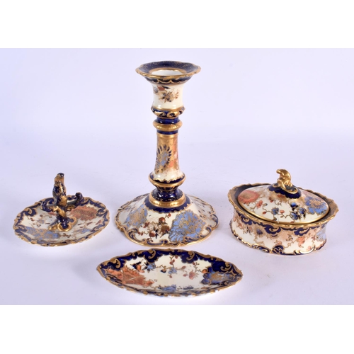 118 - Royal Crown Derby candlestick, powder box and cover, ring stand and a pin tray painted with coloured... 