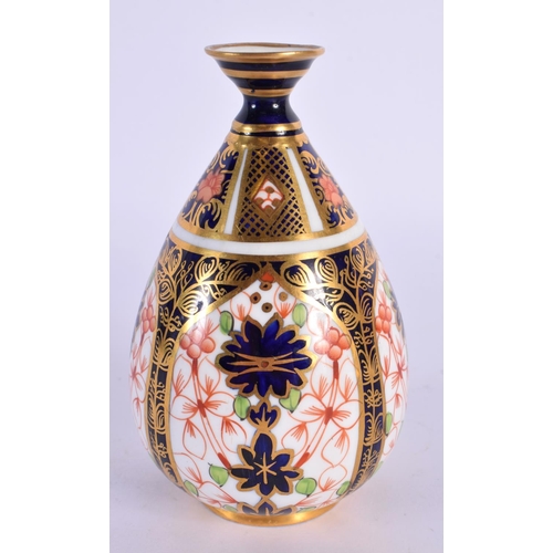 120 - Royal Crown Derby vase painted with pattern 1128, date mark for  1915. 11cm High