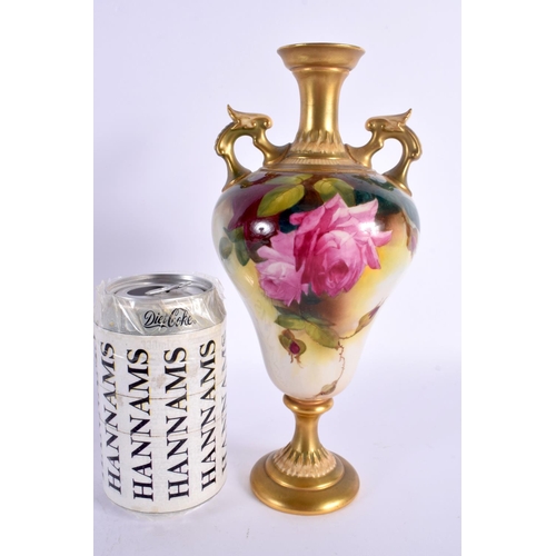 132 - Royal Worcester two handled vase painted with roses in Hadley style, shape 2426 date mark 1911. 23cm... 