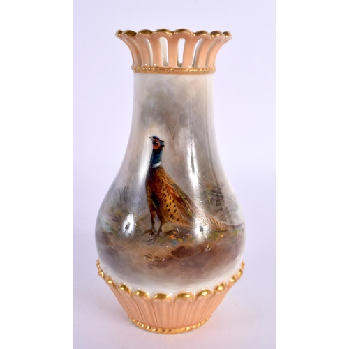 135 - Royal Worcester vase, shape 1061 G with pierced neck painted with a pheasant in landscape by Jas. St... 