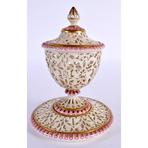 151 - Graingers Worcester fine fine reticulated  vase and cover, gilded and highlighted in puce, shield ma... 