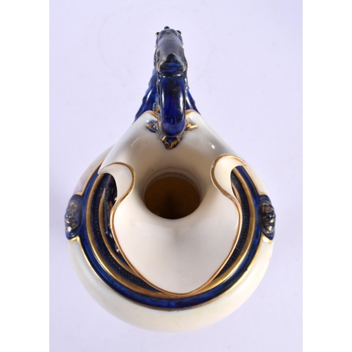 176 - Royal Worcester ewer shape 1309 painted with flowers on an ivory ground, the handle, neck and base p... 