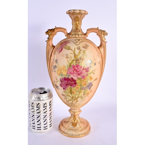 177 - Royal Worcester two handled blush ivory vase, shape 2330, painted with flowers on a scale moulded bo... 