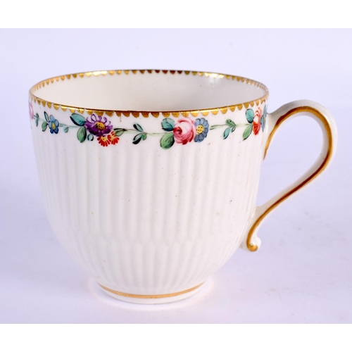 207 - 18th century Chelsea Derby reeded coffee cup painted with a chain of flowers under a dentil gilt bor... 