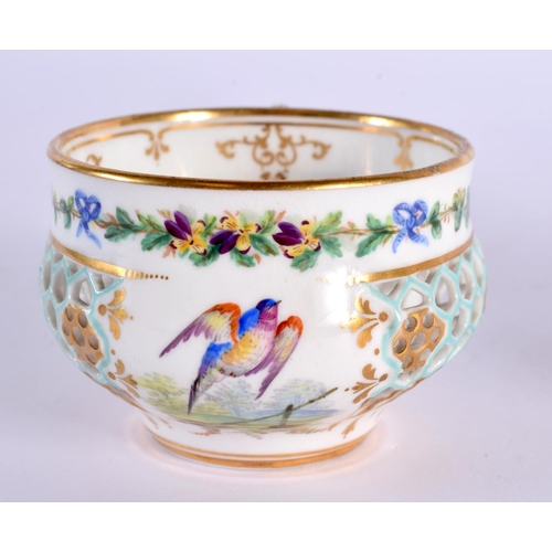 227 - Royal Worcester teacup and a saucer reticulated in the manner of George Owen both painted with birds... 