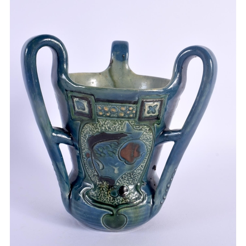 23 - AN ART NOUVEAU BRANNAM THREE HANDLED POTTERY TYG C1900, decorated with fish. 15 cm x 14 cm.