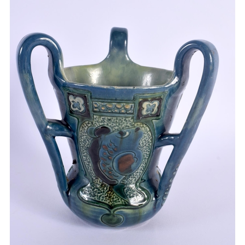 23 - AN ART NOUVEAU BRANNAM THREE HANDLED POTTERY TYG C1900, decorated with fish. 15 cm x 14 cm.