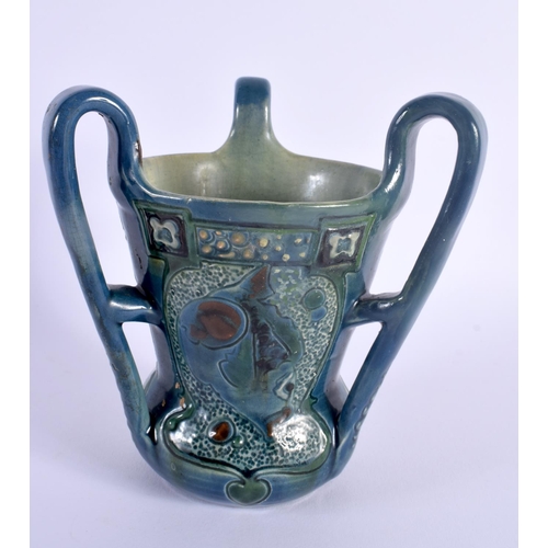 23 - AN ART NOUVEAU BRANNAM THREE HANDLED POTTERY TYG C1900, decorated with fish. 15 cm x 14 cm.