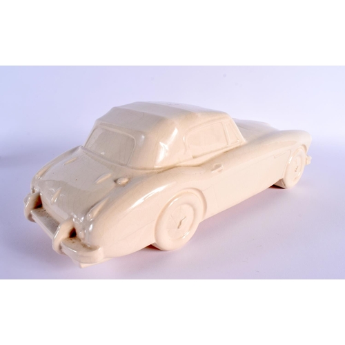 24 - A CHARMING BRISTOL POTTERY MODEL OF A VINTAGE CAR by Ted Eric Wayman. 37 cm wide.