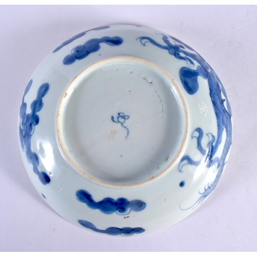 252 - A 17TH/18TH CENTURY CHINESE BLUE AND WHITE PORCELAIN DISH Ming/Qing, painted with a stylised dragon.... 