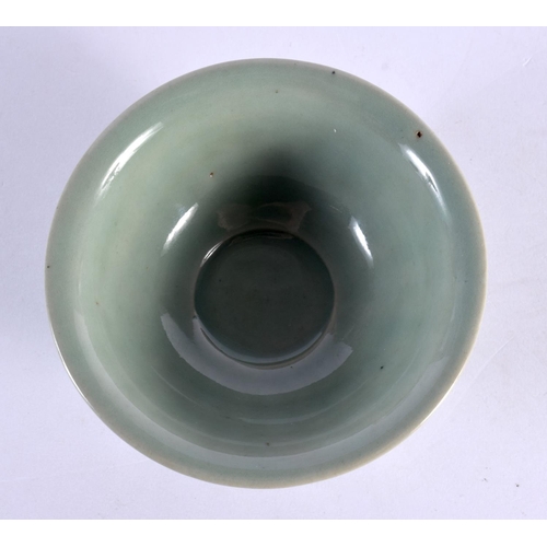 261 - AN EARLY CHINESE CELADON SCALLOPED TEABOWL probably Sung. 10.5 cm diameter.