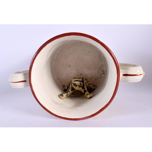 266 - A 19TH CENTURY ENGLISH TWIN HANDLED FROG MUG decorated with dogs and game. 21 cm wide.