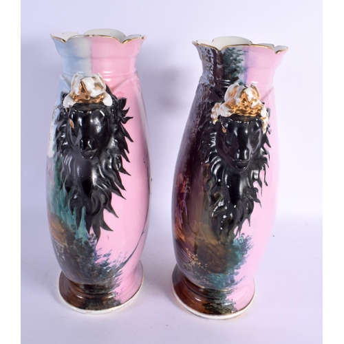 267 - A PAIR OF 19TH CENTURY FRENCH PARIS PORCELAIN VASES painted with figures in landscapes. 34 cm x 19 c... 