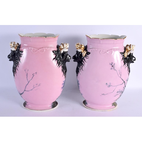 267 - A PAIR OF 19TH CENTURY FRENCH PARIS PORCELAIN VASES painted with figures in landscapes. 34 cm x 19 c... 