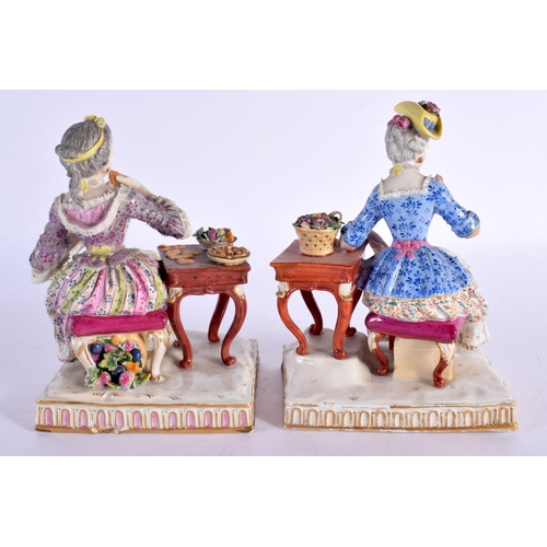 268 - A PAIR OF 19TH CENTURY GERMAN MEISSEN PORCELAIN FIGURAL GROUPS modelled beside a table. 14 cm x 11 c... 